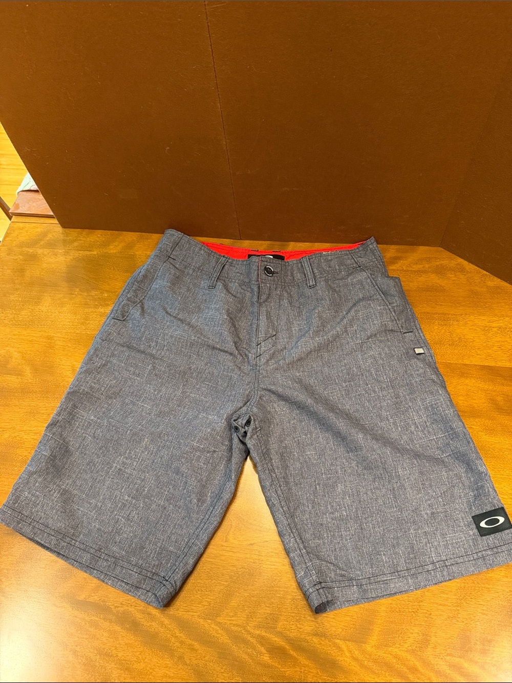Oakley Men's Gray Flat Front Shorts with Red Waistband Accent